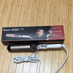 2” ceramic glazed curling iron. New in box.